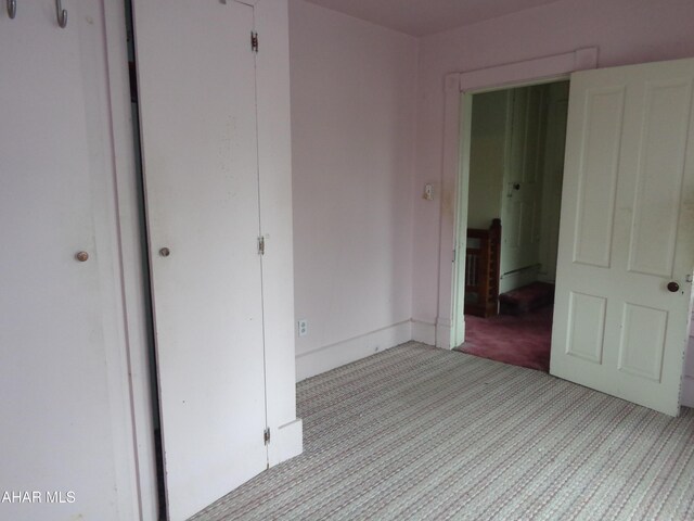 708 Blair St, Hollidaysburg, PA 16648 - unfurnished bedroom featuring a closet, light carpet, and baseboards