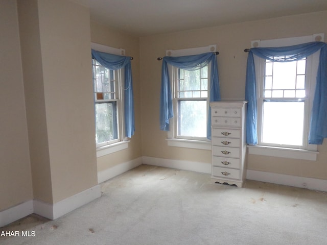 708 Blair St, Hollidaysburg, PA 16648 - unfurnished bedroom with multiple windows, light carpet, and baseboards