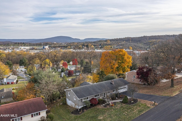 birds eye view of property with a mountain view