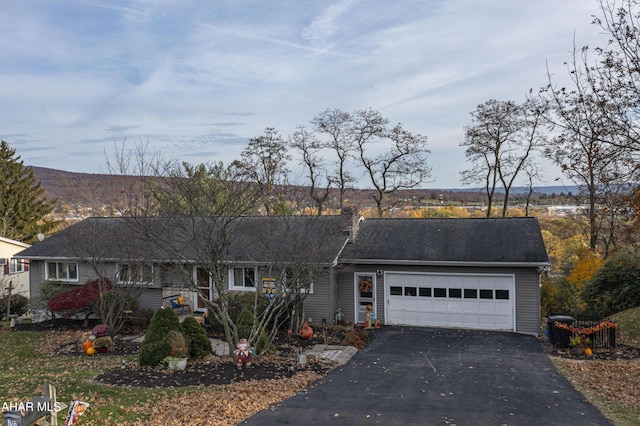 single story home featuring a garage