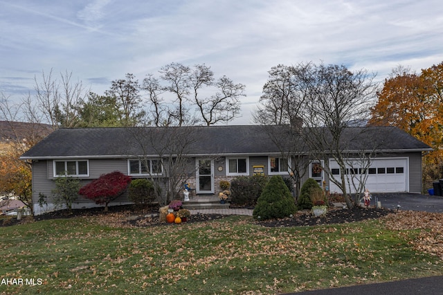 ranch-style house with a front lawn and a garage