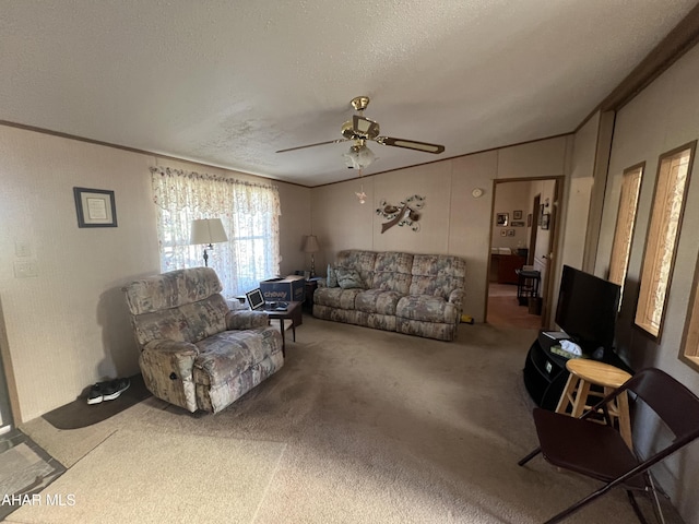 living room with carpet, ceiling fan, a textured ceiling, and vaulted ceiling