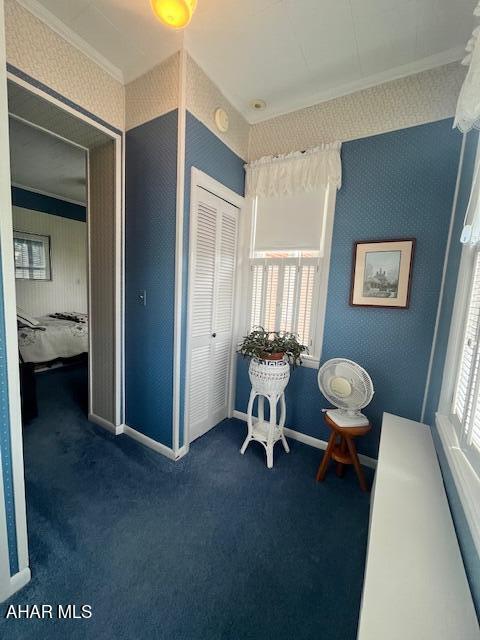 522 Wayne St, Hollidaysburg, PA 16648 - living area featuring wallpapered walls, carpet floors, and ornamental molding