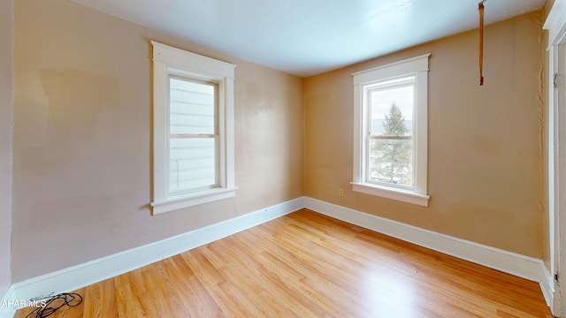 unfurnished room featuring light hardwood / wood-style floors