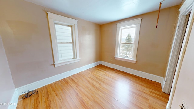 spare room with light hardwood / wood-style flooring