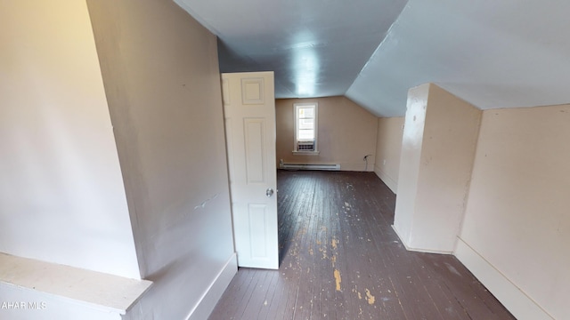 bonus room featuring lofted ceiling, dark hardwood / wood-style flooring, and a baseboard radiator