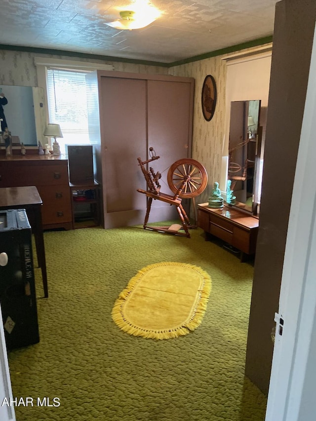 interior space featuring a textured ceiling and carpet floors