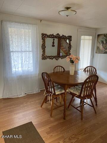 dining space featuring wood-type flooring