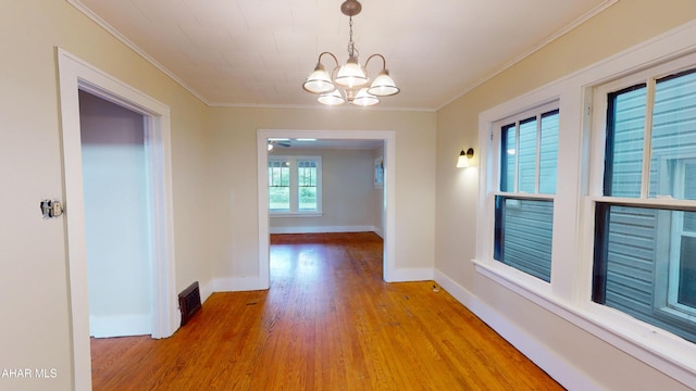 1113 Broadway, Altoona, PA 16601 - hall featuring a chandelier, wood finished floors, and ornamental molding
