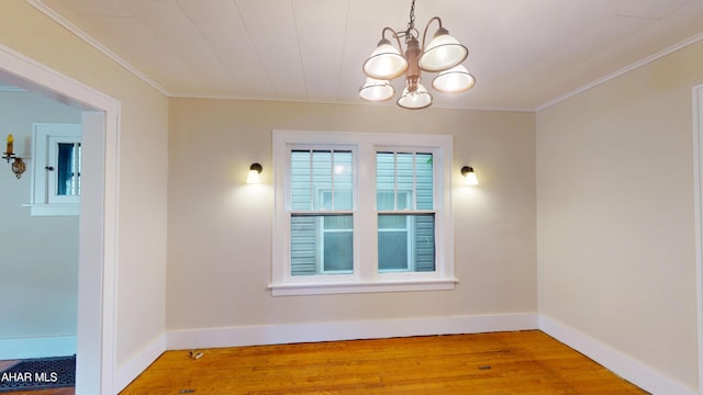 1113 Broadway, Altoona, PA 16601 - unfurnished room with a chandelier, wood finished floors, and ornamental molding