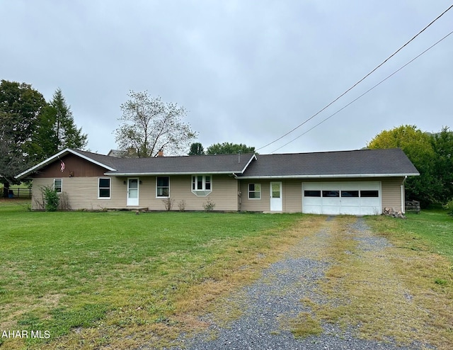 single story home featuring a front lawn and a garage