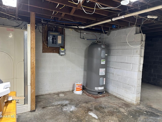 basement featuring electric panel and water heater