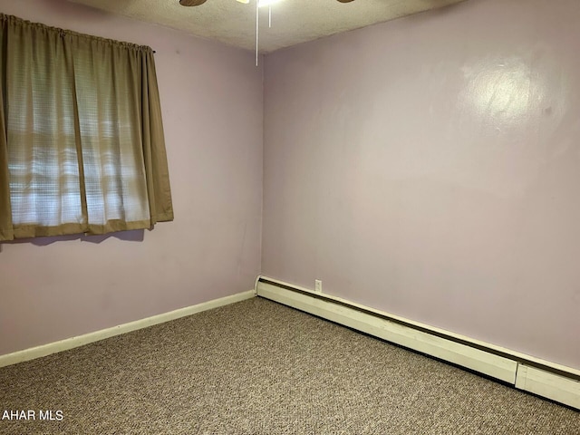 carpeted empty room with a textured ceiling, ceiling fan, and a baseboard heating unit