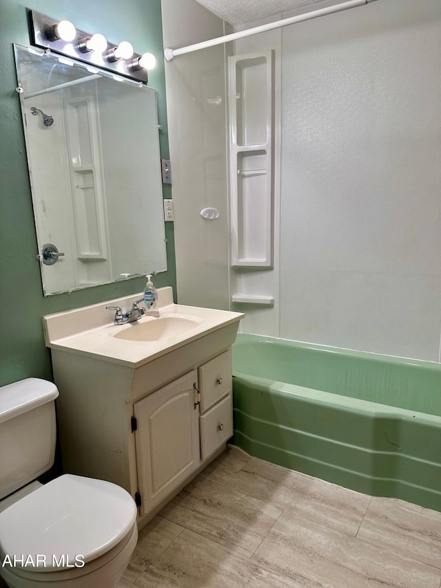 full bathroom with shower / bathing tub combination, vanity, and toilet