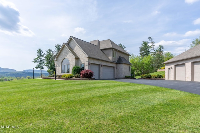 219 Scenic Pine Dr, Hollidaysburg, PA 16648 - view of front of property with brick siding, a front lawn, a garage, driveway, and a shingled roof