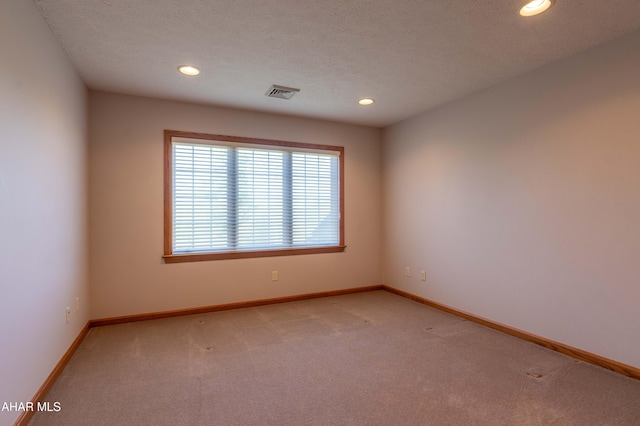 219 Scenic Pine Dr, Hollidaysburg, PA 16648 - spare room featuring light carpet, recessed lighting, baseboards, and a textured ceiling