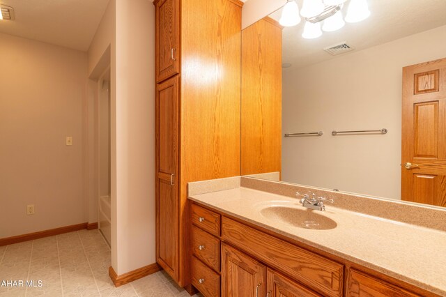 219 Scenic Pine Dr, Hollidaysburg, PA 16648 - full bath with vanity, baseboards, tile patterned floors, and a tub