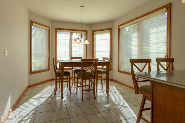 219 Scenic Pine Dr, Hollidaysburg, PA 16648 - dining room with light tile patterned floors, plenty of natural light, and baseboards