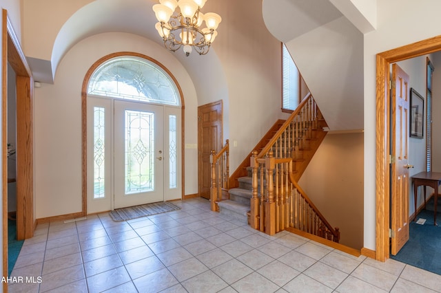 219 Scenic Pine Dr, Hollidaysburg, PA 16648 - tiled foyer entrance featuring a chandelier, baseboards, stairway, and a high ceiling