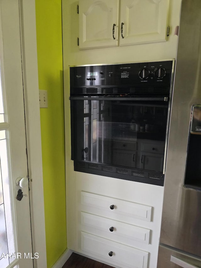 room details featuring stainless steel fridge and oven