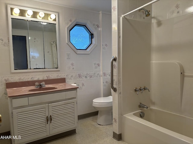 full bathroom with vanity, toilet, tile walls, and bathing tub / shower combination