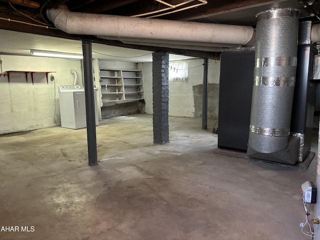 basement with separate washer and dryer