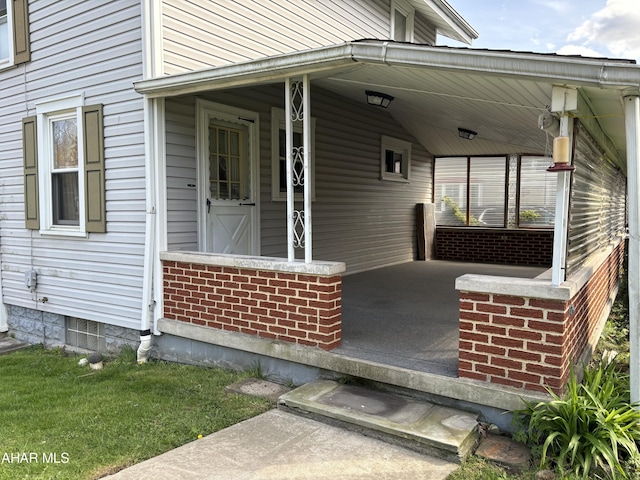 doorway to property with a porch