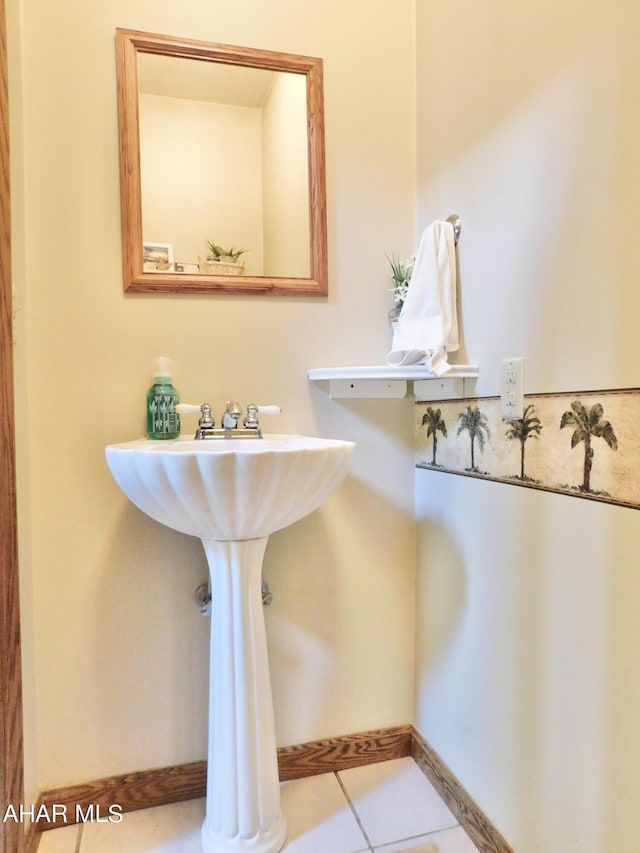 bathroom with tile patterned floors