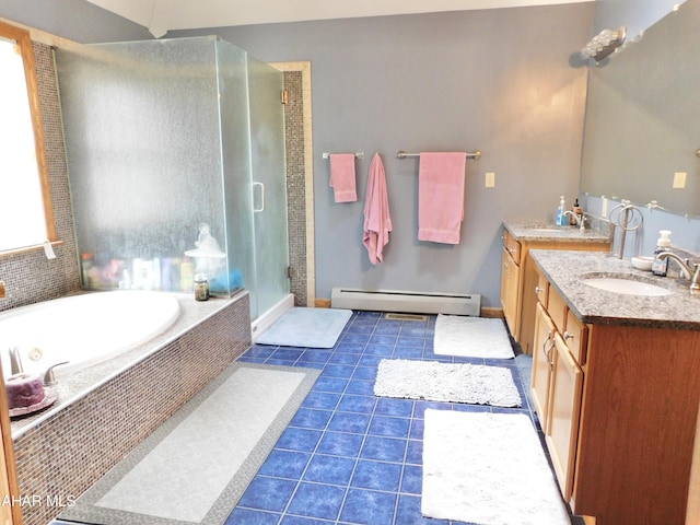 bathroom featuring baseboard heating, plus walk in shower, tile patterned flooring, and vanity