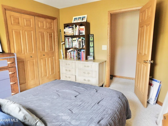 carpeted bedroom featuring a closet