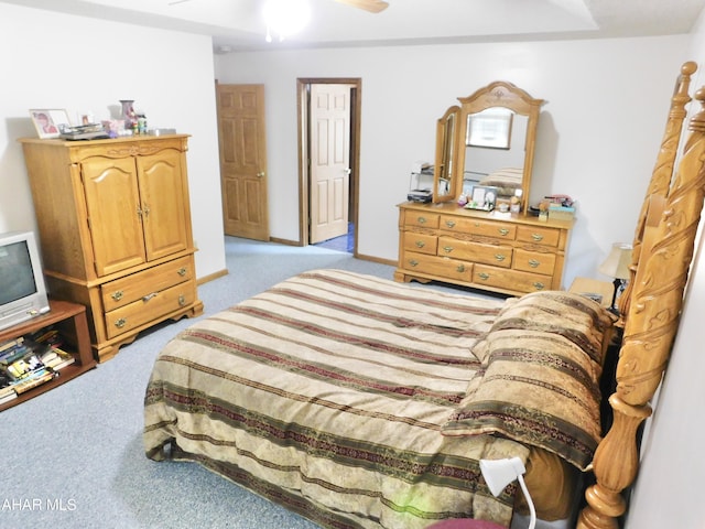 carpeted bedroom featuring ceiling fan