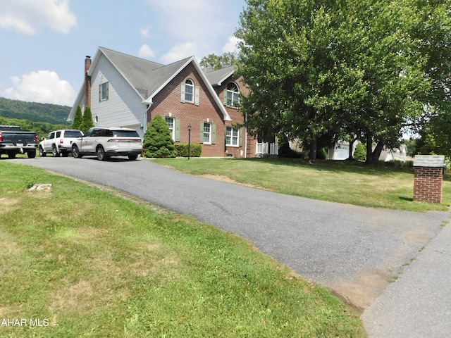 view of front of home with a front yard