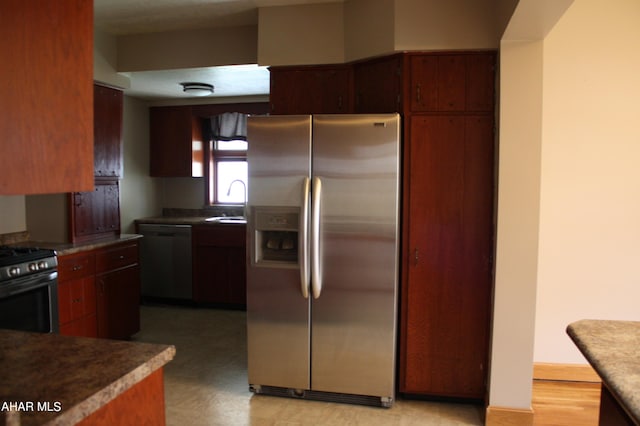 kitchen featuring stainless steel appliances and sink