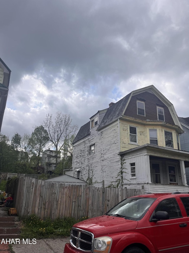 view of side of property with fence