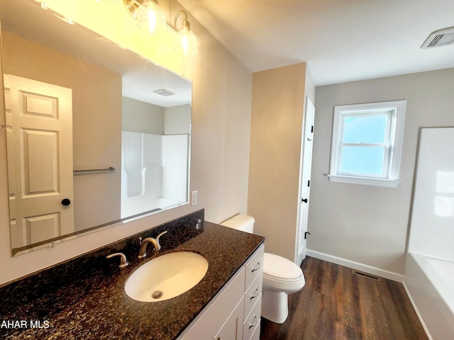 bathroom featuring hardwood / wood-style floors, vanity, and toilet