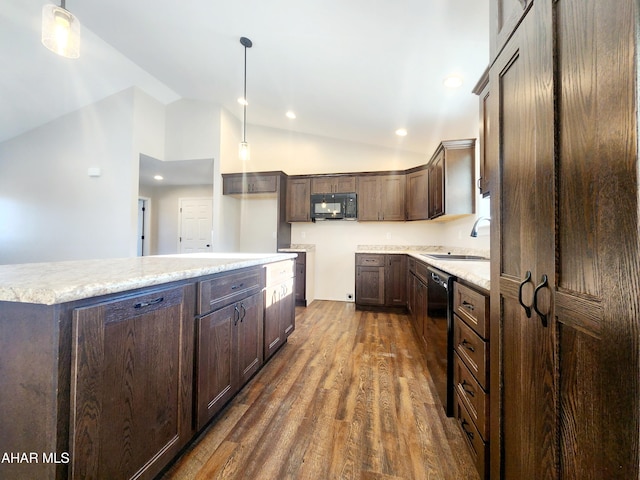 kitchen featuring black appliances, sink, hanging light fixtures, vaulted ceiling, and dark hardwood / wood-style flooring