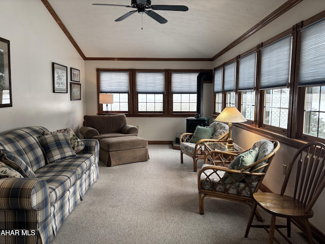 living room featuring carpet, vaulted ceiling, ceiling fan, and a healthy amount of sunlight