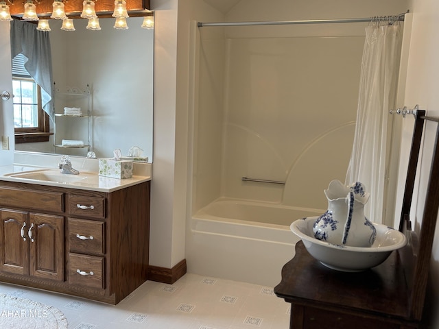 bathroom featuring vanity and shower / bathtub combination with curtain