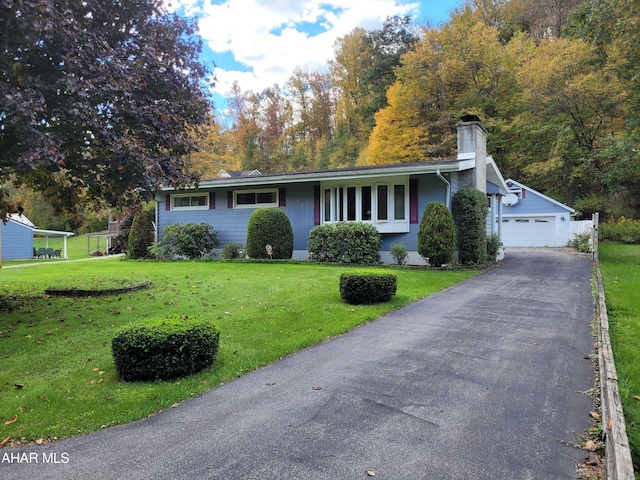 ranch-style house with a garage and a front yard