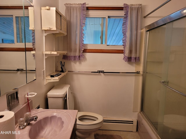 full bathroom featuring sink, a baseboard radiator, tile patterned floors, toilet, and shower / bath combination with glass door