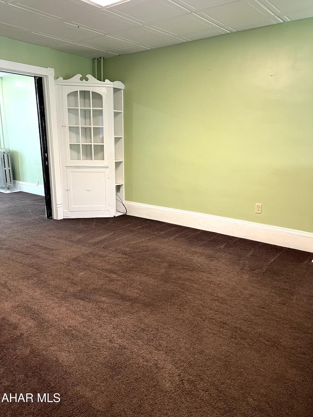 1008 N 3rd St, Altoona, PA 16601 - spare room featuring dark carpet and radiator