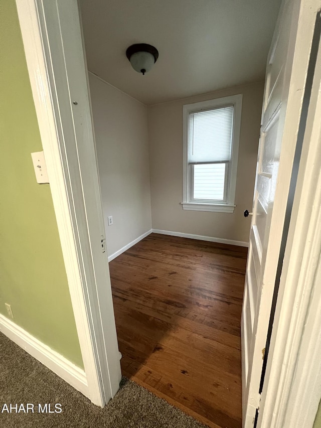 1008 N 3rd St, Altoona, PA 16601 - spare room with baseboards and dark wood-style flooring