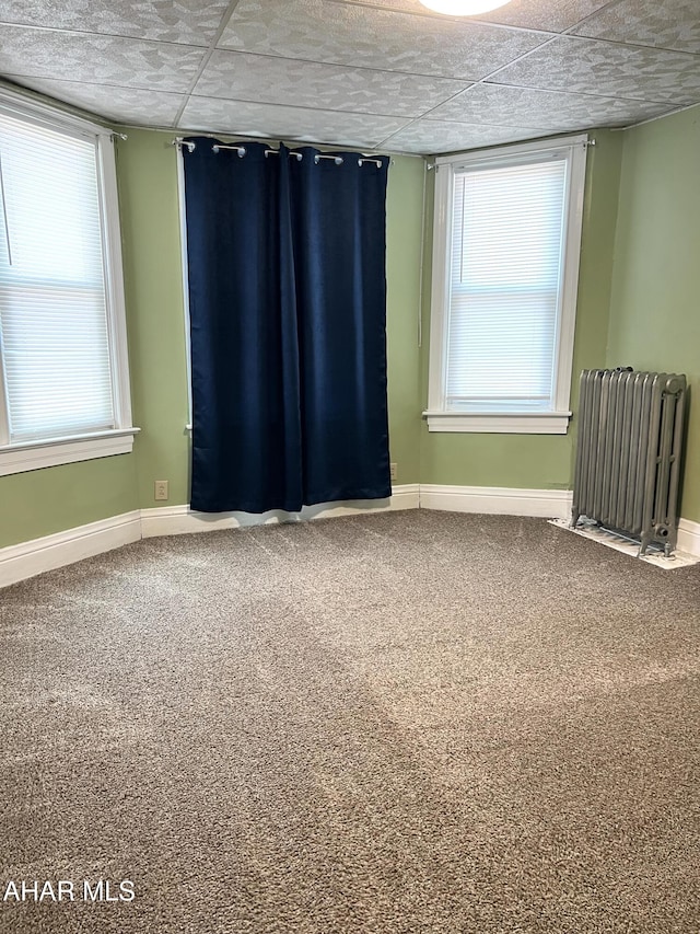 1008 N 3rd St, Altoona, PA 16601 - carpeted empty room with radiator and baseboards