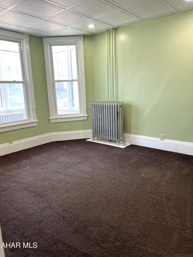 1008 N 3rd St, Altoona, PA 16601 - empty room with radiator, dark carpet, recessed lighting, and an ornate ceiling