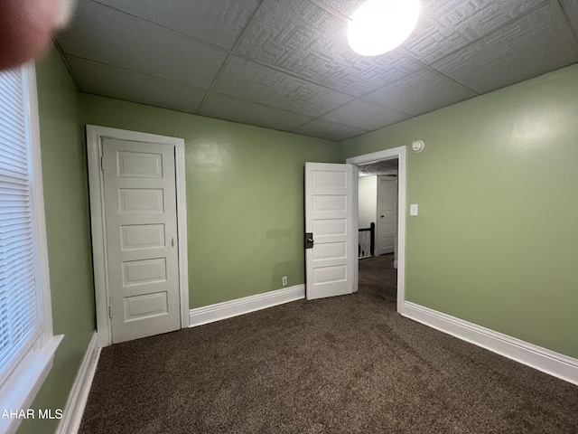 1008 N 3rd St, Altoona, PA 16601 - unfurnished bedroom featuring dark colored carpet and baseboards
