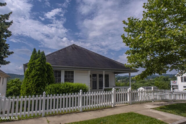 904 Holliday Hills Dr, Hollidaysburg, PA 16648 - view of front of house featuring a fenced front yard, french doors, and roof with shingles