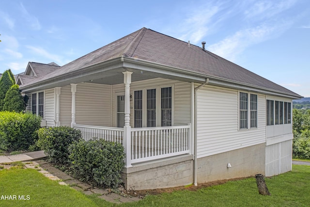 904 Holliday Hills Dr, Hollidaysburg, PA 16648 - view of property exterior featuring covered porch, a shingled roof, and a lawn