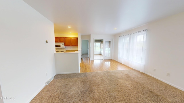 904 Holliday Hills Dr, Hollidaysburg, PA 16648 - unfurnished living room featuring light carpet and recessed lighting