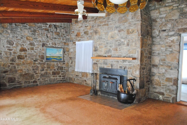 unfurnished living room featuring carpet floors, wooden ceiling, beamed ceiling, and a ceiling fan