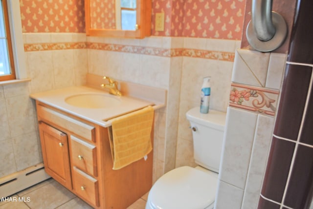 bathroom with toilet, wallpapered walls, and a baseboard heating unit